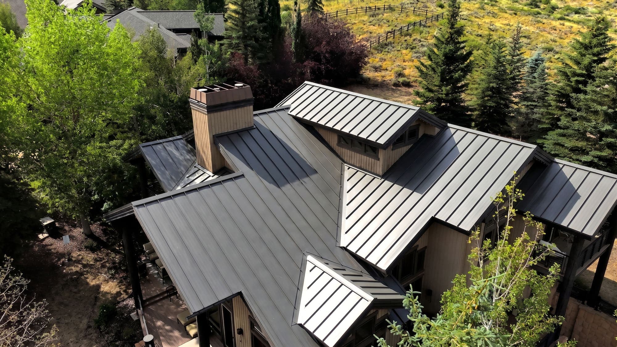 The same home rendered in Orbit with a Gun Metal Gray standing seam metal roof.